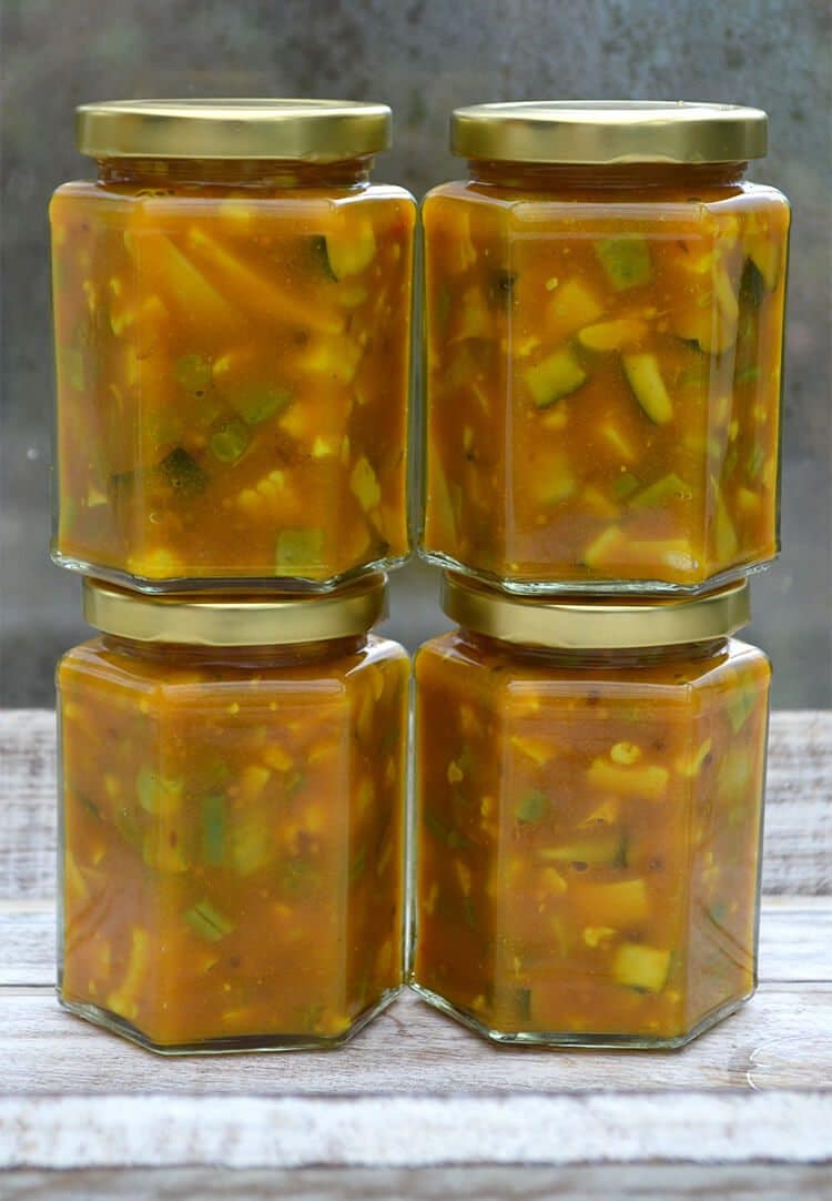Homemade Piccalilli - a pickle made using cauliflower, courgettes, green beans, peppers, garlic, mustard, and vinegar