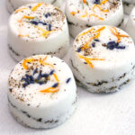 A natural herbal bath bombs recipe with essential oils, Epsom salts, lavender and calendula. The mold idea makes the bath bombs very easy to make #herbalskincare #naturalskincare #diybath